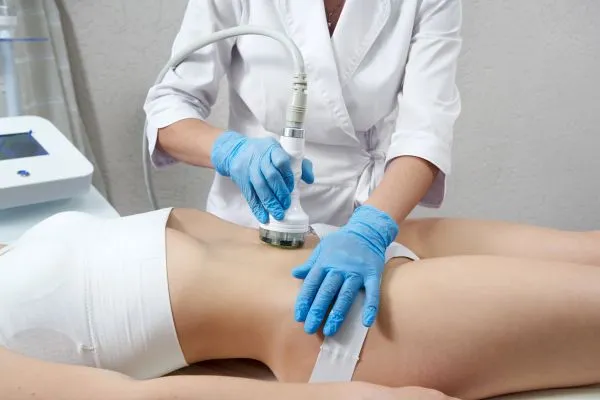 Lost the Weight but Not the Loose Skin? 2 woman having HIFU treatment on her stomach to combat loose skin Middlesex following weight loss